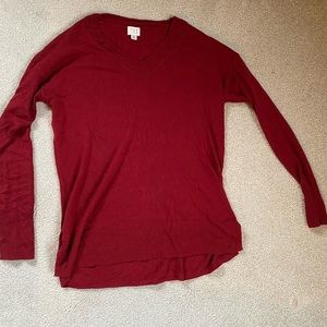a New Day red sweater
